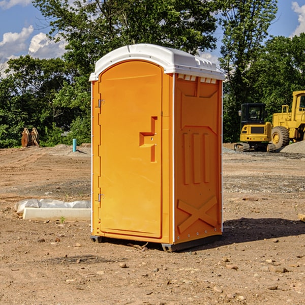 what is the cost difference between standard and deluxe portable restroom rentals in Hancock County